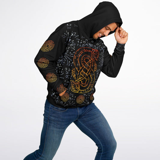 Man wearing a black all-over print hoodie with a vibrant orange and yellow serpent design, surrounded by Viking-inspired runes and intricate patterns.