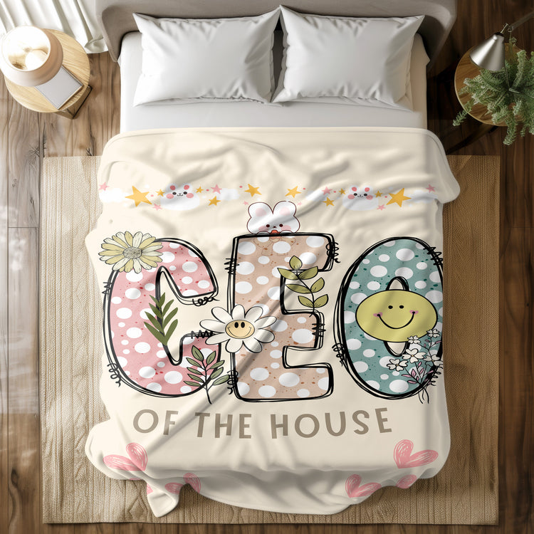 Personalized fleece Sherpa blanket with 'CEO of the House' design featuring colorful polka dots, flowers, and smiley faces, perfect for cozy home décor or gifting