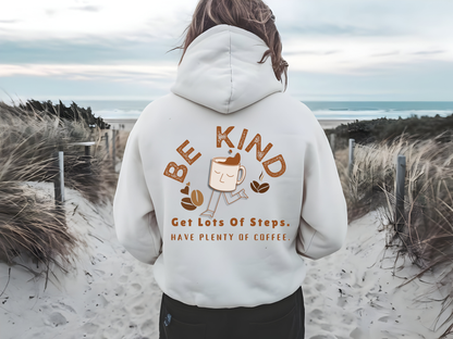 Be Kind Coffee Lover Hoodie with walking coffee cup design for women, featuring motivational text 'Get Lots of Steps, Have Plenty of Coffee.' Cozy white hoodie perfect for coffee enthusiasts and step trackers.
